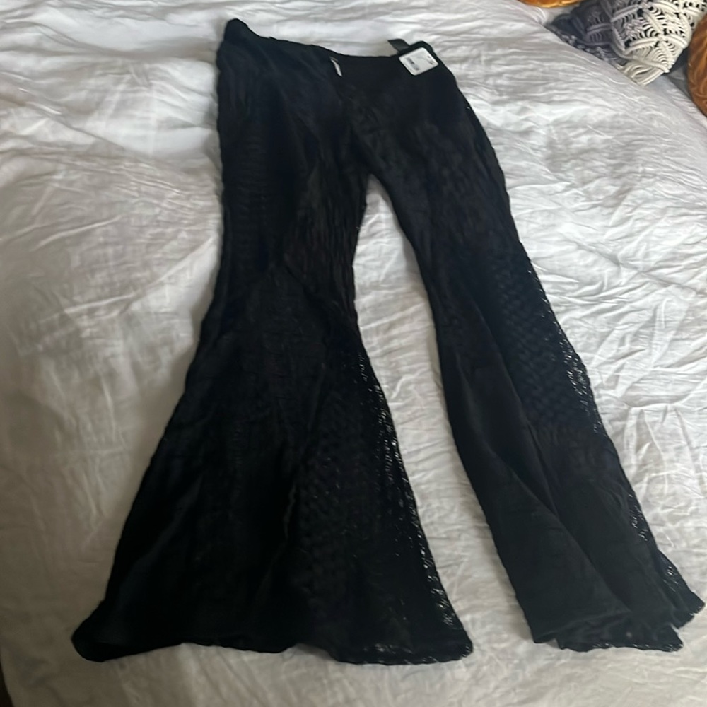 Textured flare pants. Beautiful Patching details.